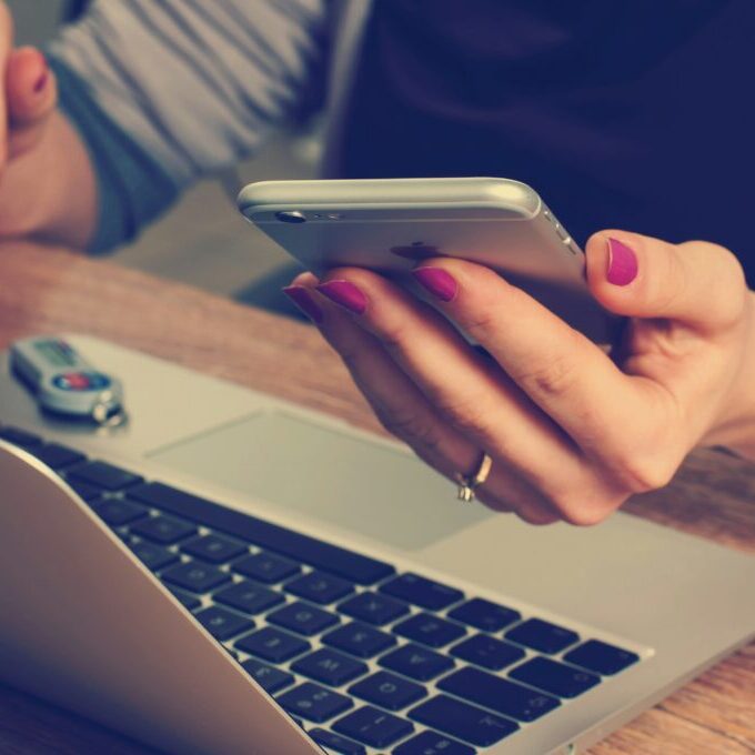 firmbee-com-SpVHcbuKi6E-unsplash person holding phone